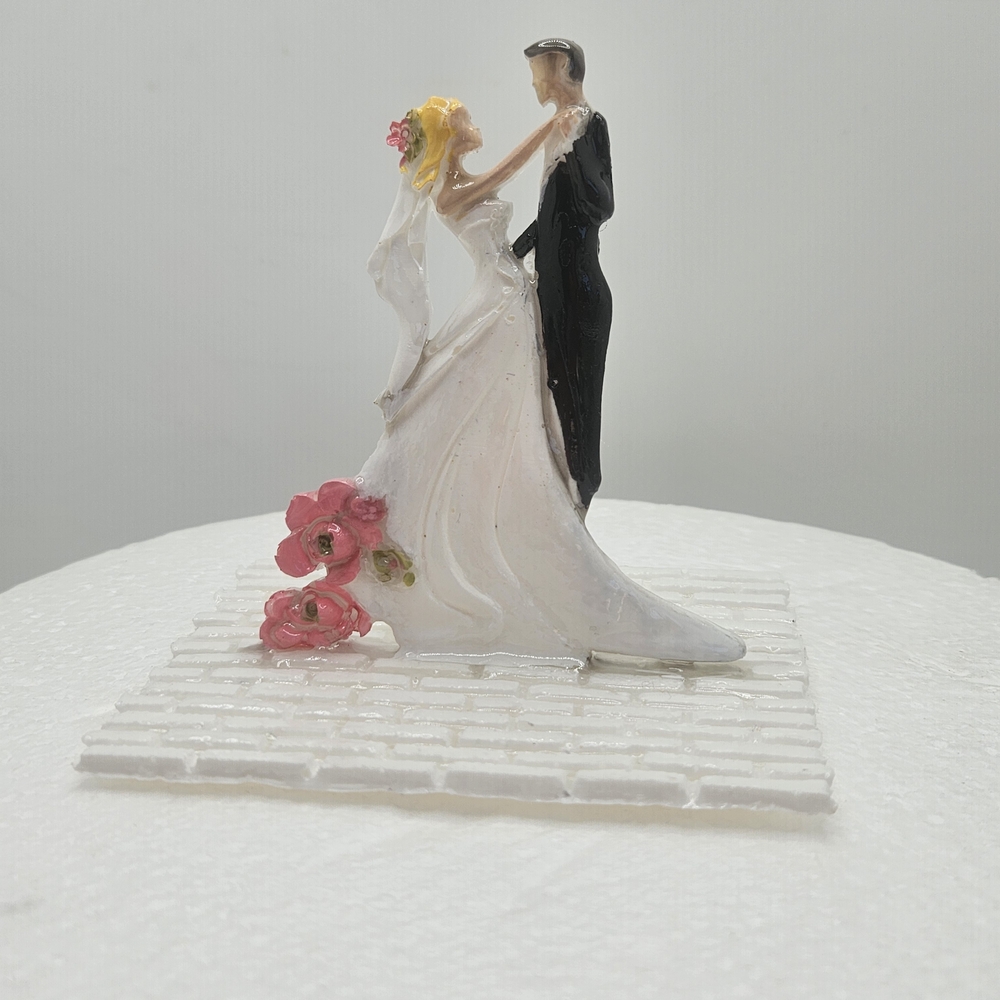 Elegant Wedding Cake Topper with Bride and Groom